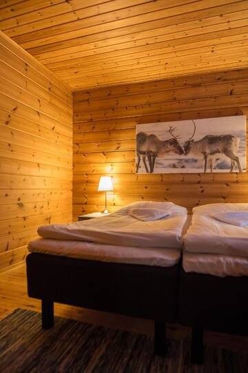 Фото номера Коттедж с 2 спальнями и сауной Дома для отпуска Torassieppi Cottages г. Särkijärvi 10