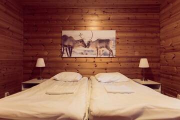 Фото номера Коттедж с 2 спальнями и сауной Дома для отпуска Torassieppi Cottages г. Särkijärvi 18