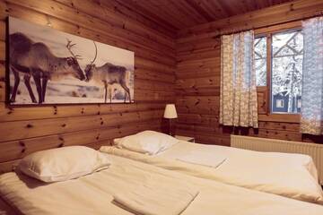 Фото номера Коттедж с 2 спальнями и сауной Дома для отпуска Torassieppi Cottages г. Särkijärvi 19