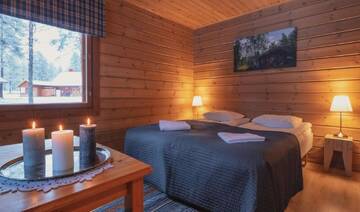Фото номера Двухместный номер с 2 отдельными кроватями Дома для отпуска Torassieppi Cottages г. Särkijärvi 2